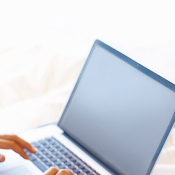 A picture of business stakeholder using a laptop symbolising the interaction with Oakford Group