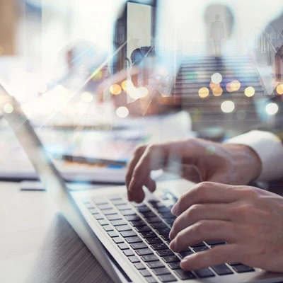 Oakford Group stakeholder typing on a laptop